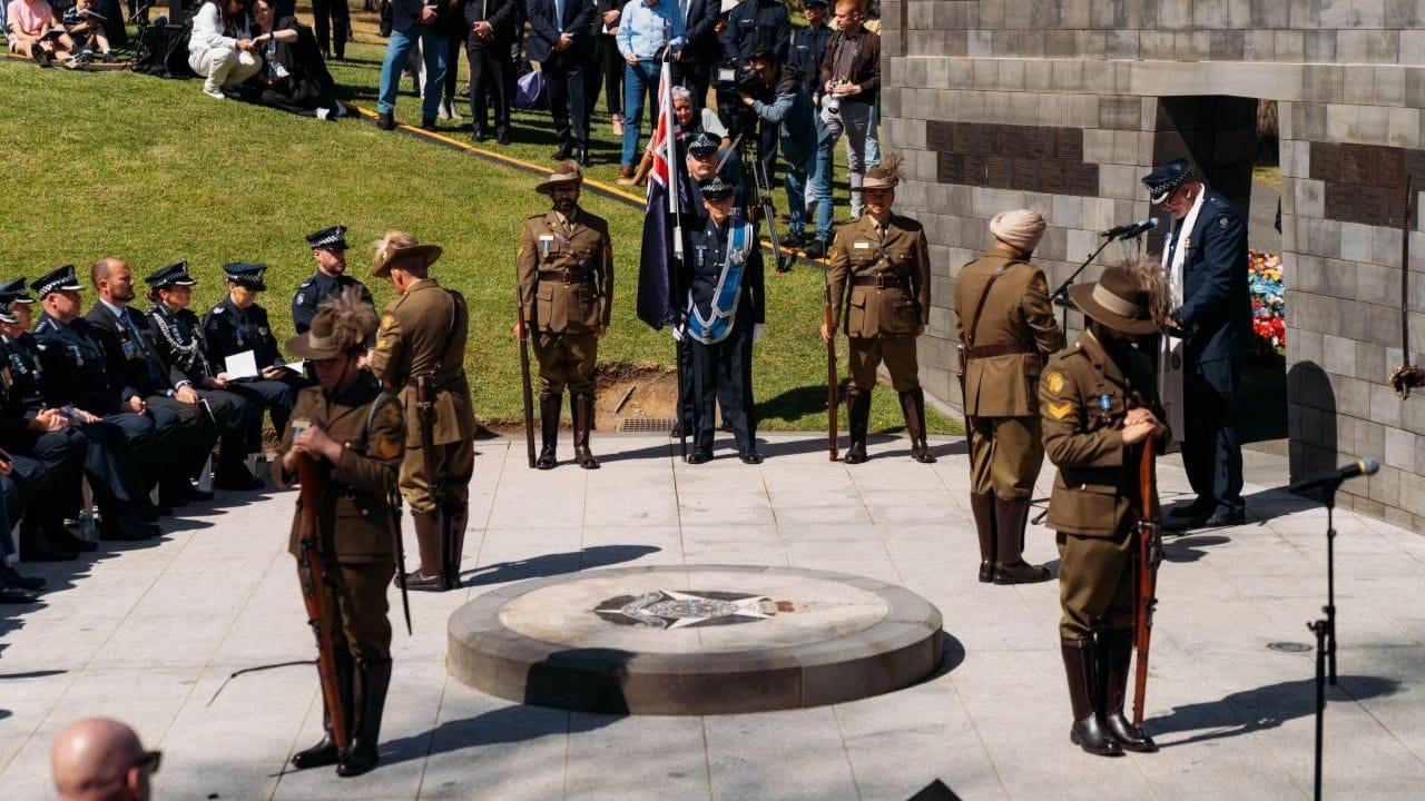 Protective services officers guarding the Victoria Police Memorial during the ceremony. 